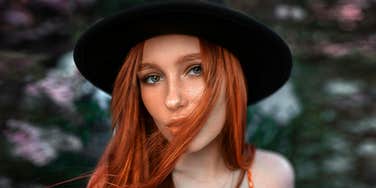 person smiling outwardly while carrying subtle emotional tension, illustrating the psychological signs people often show when they rebound too quickly after a breakup.