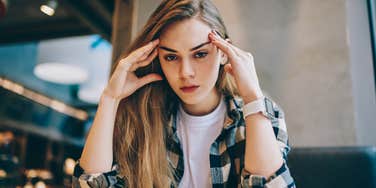 stressed gen z woman looking exhausted