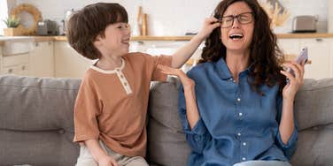 kid annoying his mom