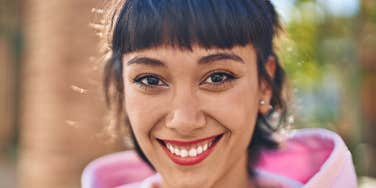 truly nice woman smiling outside