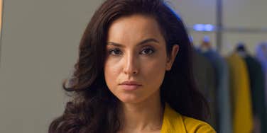 sad serious woman who grew up with strict parents