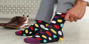 Person wears a sock that makes them smarter.