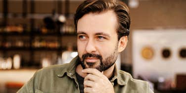 man appearing emotionally distant, suggesting uncertainty and relationship disengagement