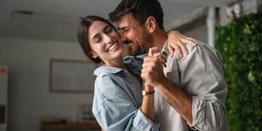 sweet couple dancing together deeply in love