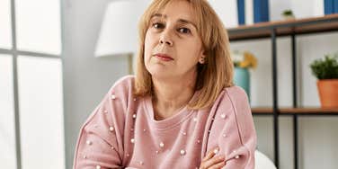 deeply kind woman crossing arms learning lessons too late