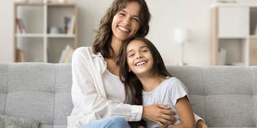 mom gentle parenting daughter smiling together
