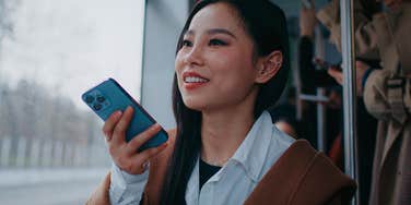 rude woman with no common sense talking on speakerphone on public transit