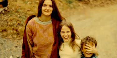 siblings in the 1970s goofing around