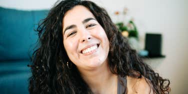 confident smiling woman with relaxed posture, illustrating a type-A personality grounded in preparation, self-trust, and emotional steadiness rather than intensity