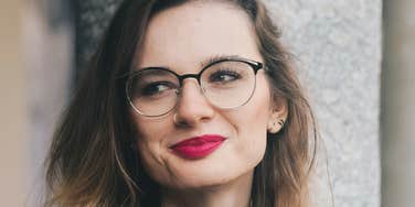 Woman is unbothered and happy.