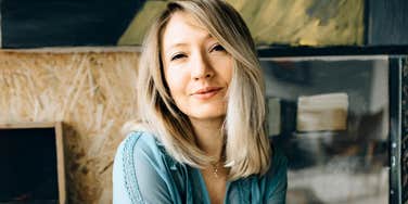 joyful person smiling with light carefree energy, illustrating the easy daily habits that help someone stay unbothered and genuinely happy