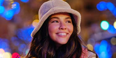 Woman is unbothered and happy for the holidays.