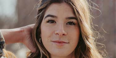 Woman is unbothered and protected from bad vibes.