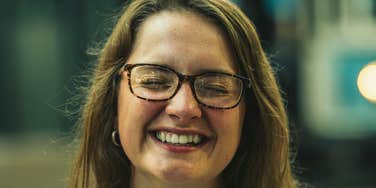 Woman is unpressed and happy.