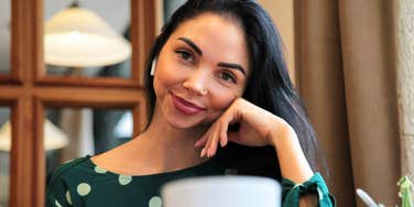 confident accomplished woman working with calm focus and balance, illustrating the simple rules women follow to build their dream careers without burning out