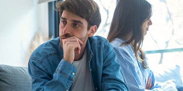 sad couple turned away from each other falling out of love