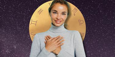 Woman holding her hands to her heart in front of zodiac symbols, representing three zodiac signs ending loneliness after December 4, 2025