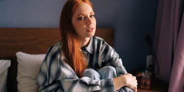 lonely isolated woman with no friends sitting alone at home