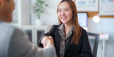woman getting hired during job interview