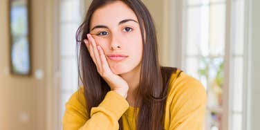 Everyday Things Eldest Daughters Were Expected To Handle On Their Own stressed eldest daughter thinking at home