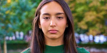 young woman looking confused and concerned about her future