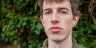 low-quality man with bad habits looking serious