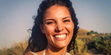 Smiling woman who has rare traits that make her beautiful inside and out