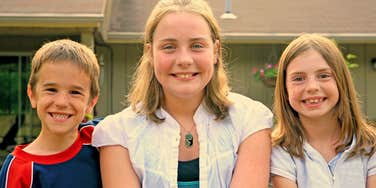 millennial kids siblings smiling not worrying about money