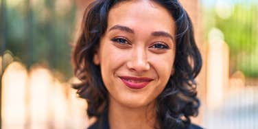 happy cheerful woman who repels narcissists