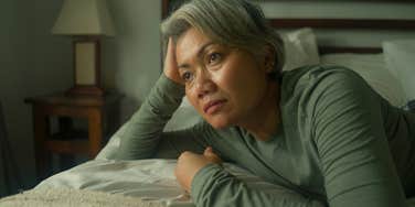 older sad woman thinking about her childhood with bad parents