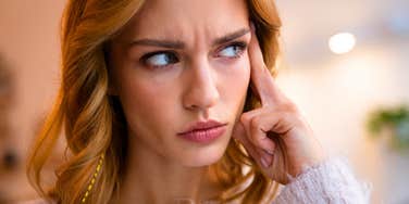 highly intelligent woman thinking after forgetting someone's name