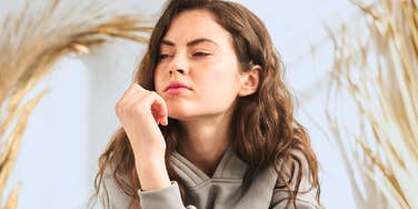 Woman with a guarded expression struggling to trust others