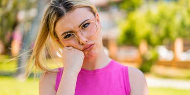 annoyed young woman feeling bitter about her life