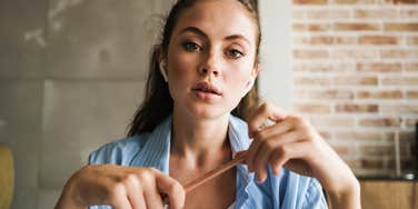 woman trying hard to sound smart in conversation about to speak