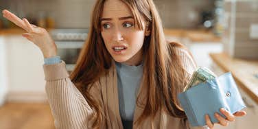 woman who makes decent money but still feels like life is unaffordable