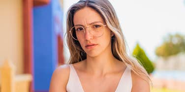 high-level thinking woman annoyed by polite people