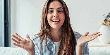 happy brilliant woman in conversation trying to gain control