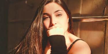 Portrait of a woman in warm natural light with a thoughtful expression