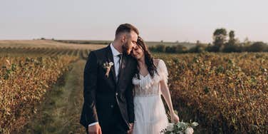 happy couple throwing affordable wedding outside