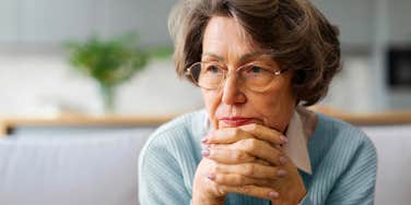 worried boomer woman thinking about her finances