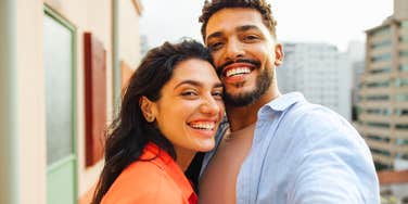 Couple smiling together, relaxed and close