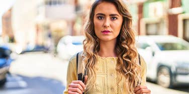 Someone Who Gets Annoyed When People Walk Too Slowly Usually Has These Specific Personality Traits annoyed woman walking on the street