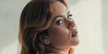 Woman is hiding her feelings.