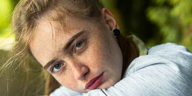 ridiculously insecure woman staring ahead