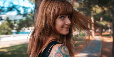 young woman walking in the park 