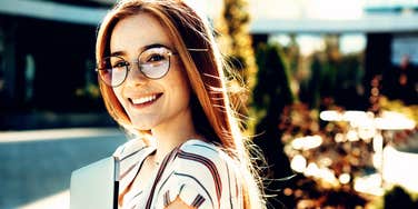 Smart young woman doing things normal people find challenging 