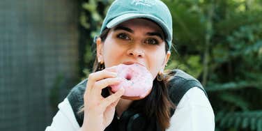 Young mom taking a quiet moment in public, reflecting on the normal chaos of parenting.