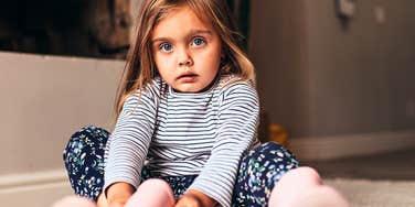 Little kid in boots whose parents didn't teach old-fashioned manners