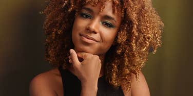 A truly admired woman looks confident and happy 