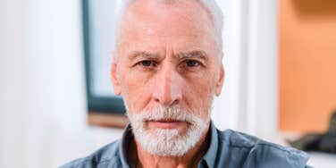 serious man avoiding responsibility looking angry when confronted